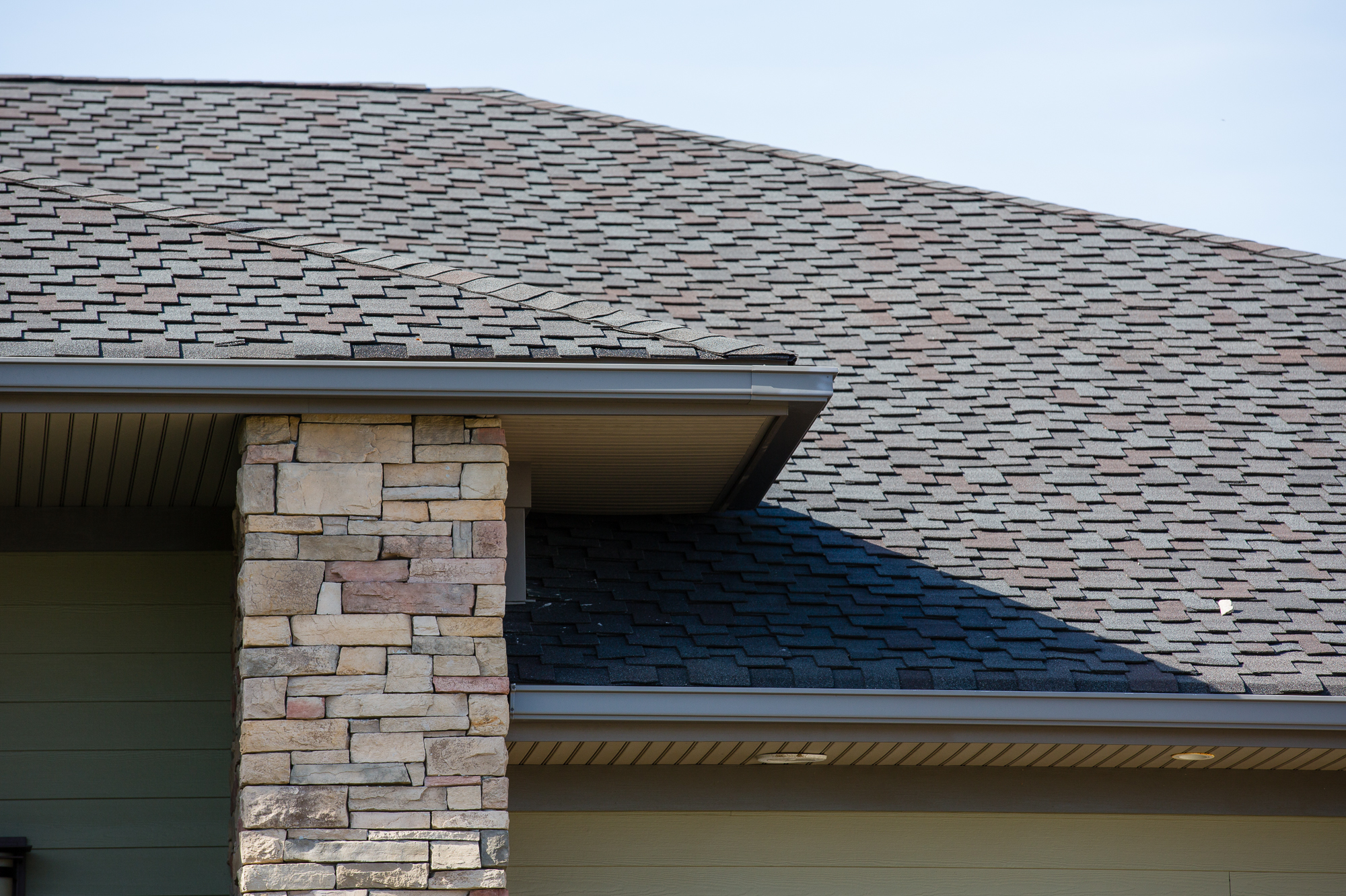 Close-up of seamless gutters with premium leaf guards, showcasing advanced drainage and roof protection system.