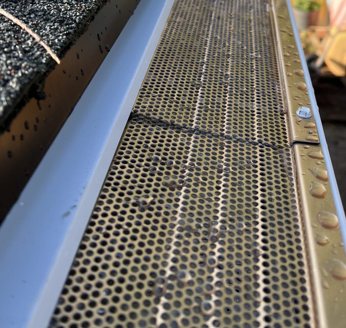 An image of TruthGuard gutter protectors on a FreeRain gutter.